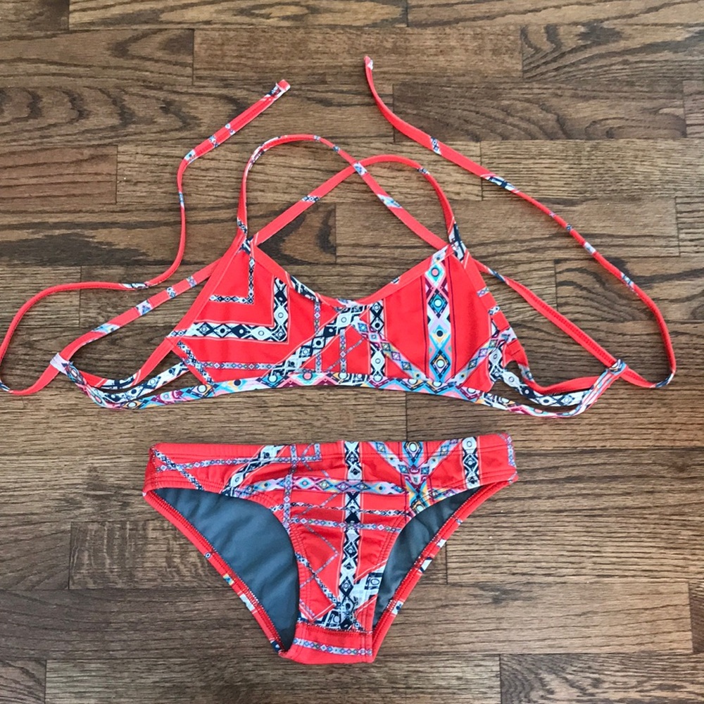 Jolyn orange bikini set with print. Full coverage bottoms. Tie back style.